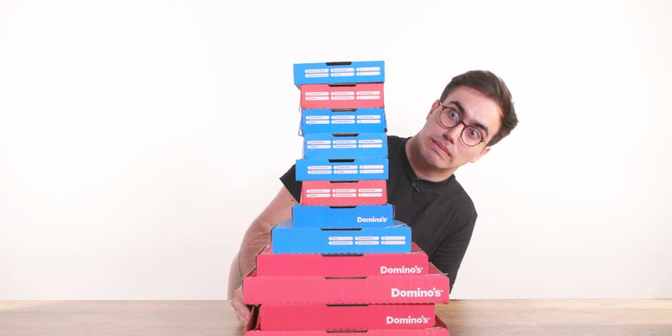 Harry Kersh sat behind a stack of pizza boxes