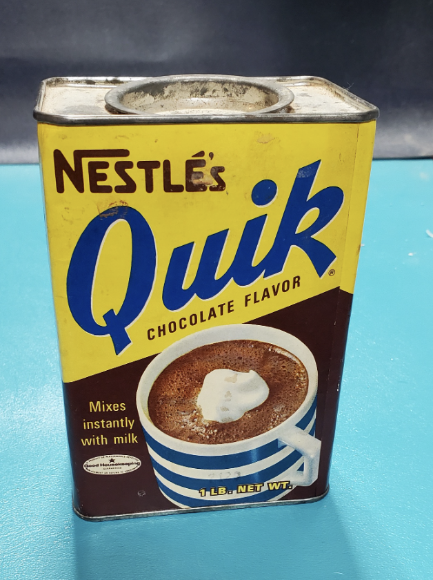 A tin container of Nestlé's Quik mix