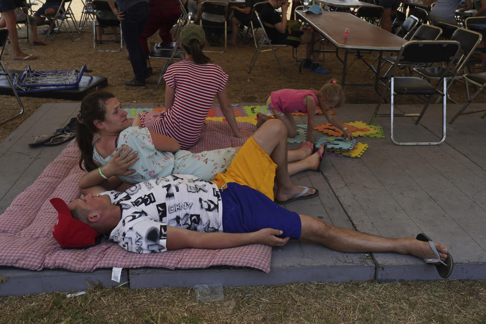 Ukrainian refugees rest at a camp in Utopia Park, Iztapalapa, Mexico City, Monday, May 2, 2022. (AP Photo/Marco Ugarte)