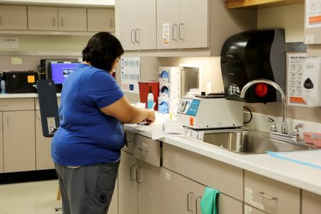 A staff member at Planned Parenthood South Austin Health Center labels blood samples at the clinic in Austin, Texas, U.S. June 27, 2016. REUTERS/Ilana Panich-Linsman - RTX2IIU9