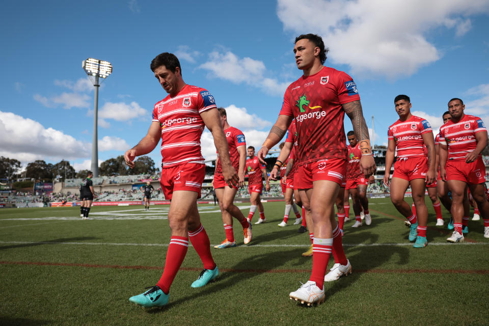 Ben Hunt and his teammates walk off the field.