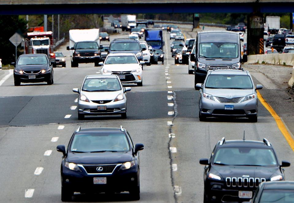 Heavy traffic travels on the Mass Pike in Natick in 2019. State Highway Administrator Jonathan Gulliver said that highway traffic, "for all intents and purposes, is back to about 2019 levels on most roadways in Massachusetts."