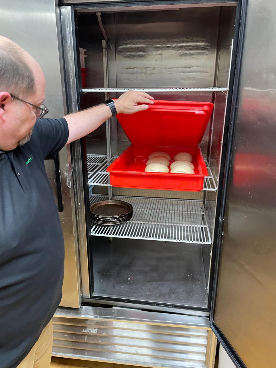 Mark Cranston looks over the fresh dough at Cranston's Pub.