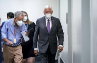 Reporters vie for updates as House Majority Leader Steny Hoyer, D-Md., leaves a Democratic Caucus meeting in the basement of the Capitol in Washington, Tuesday, Sept. 28, 2021. Work continues behind the scenes on President Joe Biden's domestic agenda and a bill to fund the the government. (AP Photo/J. Scott Applewhite)