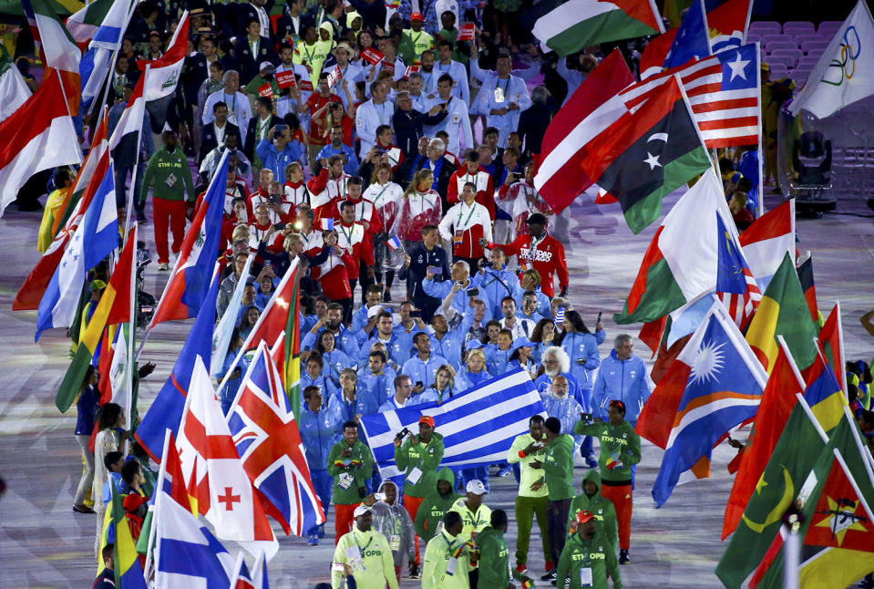 <p>Athletes take part in a parade during the closing ceremony. (REUTERS/Vasily Fedosenko) </p>