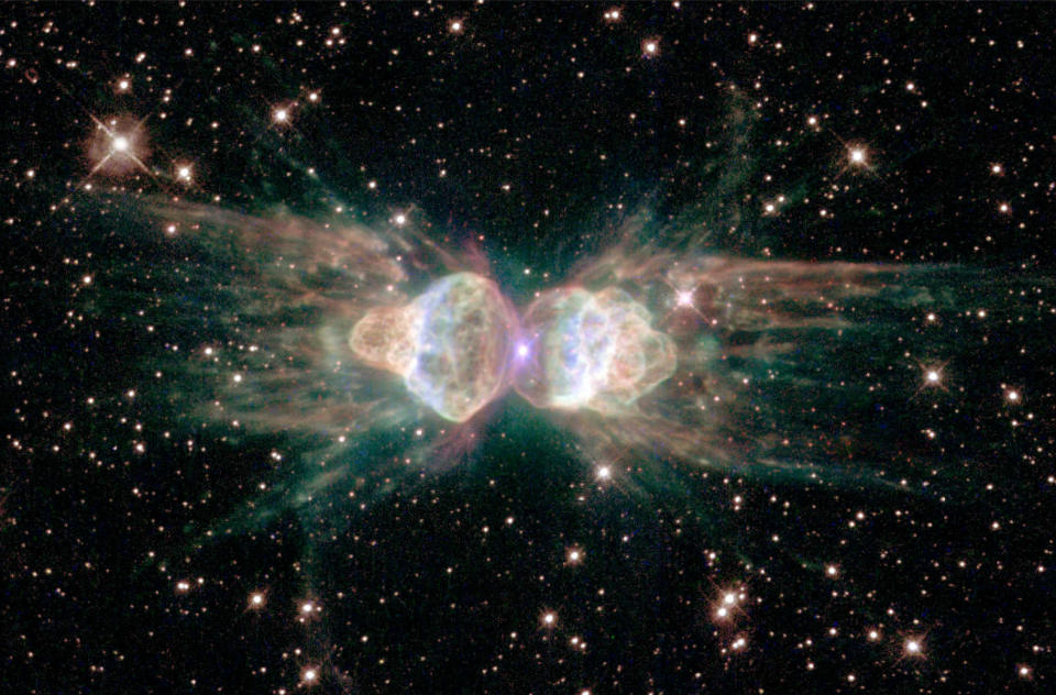 A Hubble Space Telescope image released February 1, 2001 of the so-called "ant nebula" (Menzel 3, or Mz3) reveals the "ant's" body as a pair of fiery lobes protruding from a dying star. The Hubble images directly challenge old ideas about the last stages in the lives of stars. (Photo by NASA/Newsmakers/Getty Images)