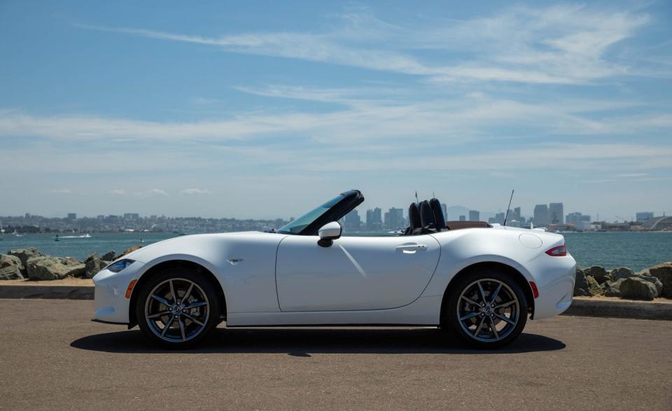 <p>The MX-5 Miata is on its third full redesign since the original made its debut back in 1989, and each of the four generations of Miatas has been characterized by a long nose, a short trunk, and seating for two-classic sports-car stuff. Today's model is styled with a bit less whimsy than Miatas past, with an intense stare and a muscular little body. </p>