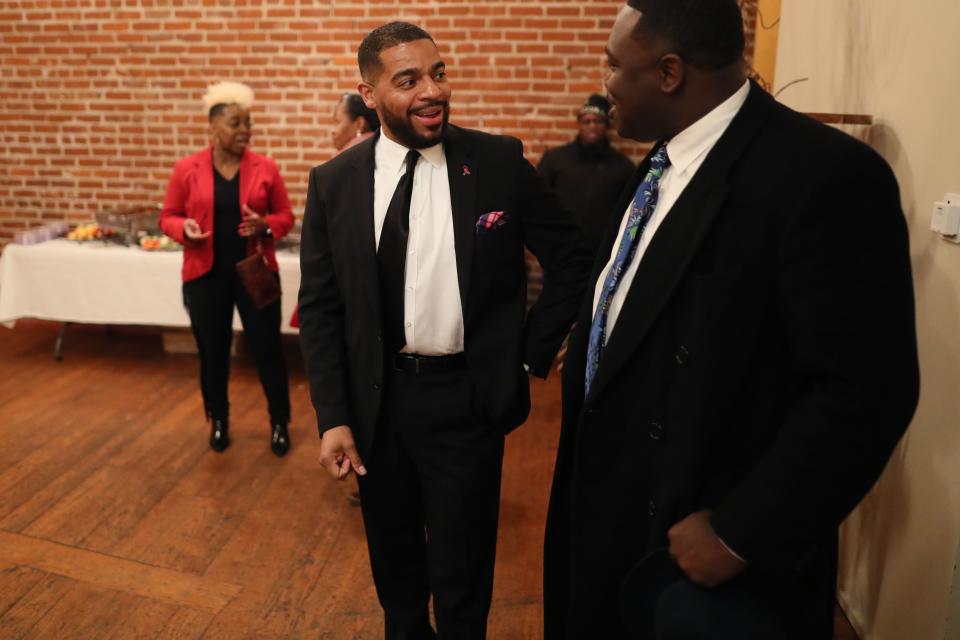 Memphis police officer and LGBTQ liaison for the department, Davin Clemons, who sued for discrimination against the MPD in 2014, chats with attendees during his Memphis City Council run kickoff party in downtown Memphis, Tenn. on Jan. 31, 2019.