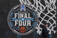 The NCAA Final Four logo for the NCAA college basketball tournament is painted on a window in downtown Indianapolis, Wednesday, March 17, 2021. (AP Photo/Darron Cummings)