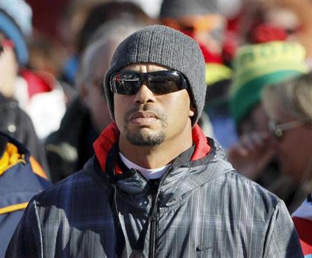 Golfer Tiger Woods of the U.S. watches the Women's World Cup Downhill skiing race in Val d'Isere, French Alps, December 21, 2013. REUTERS/Robert Pratta