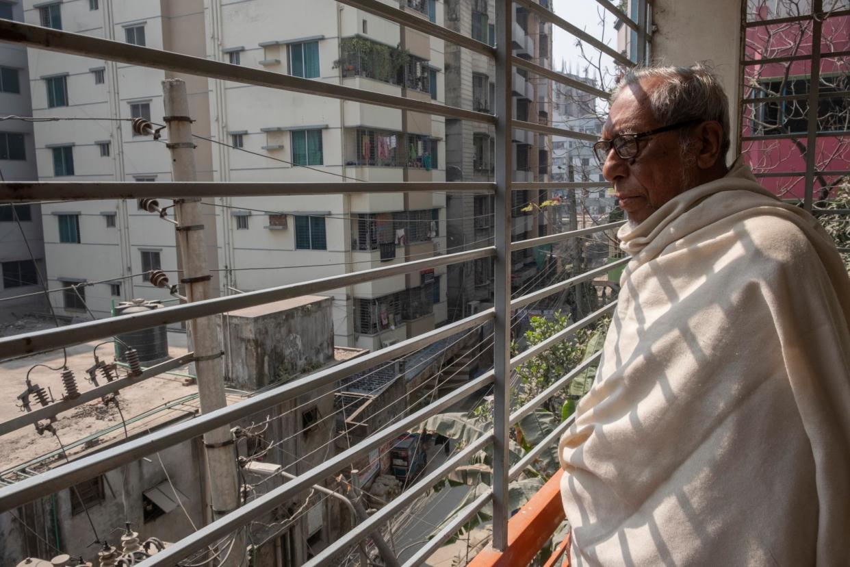 <span>Mohammed Bodi-Uz Zaman, 85, rarely leaves his apartment in Dhaka. ‘I used to walk around by myself but I don’t feel safe any more,’ he says.</span><span>Photograph: Abir Abdullah/The Guardian</span>