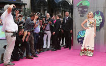 <p>Margot Robbie dutifully poses for the paparazzi at the photocall. </p>