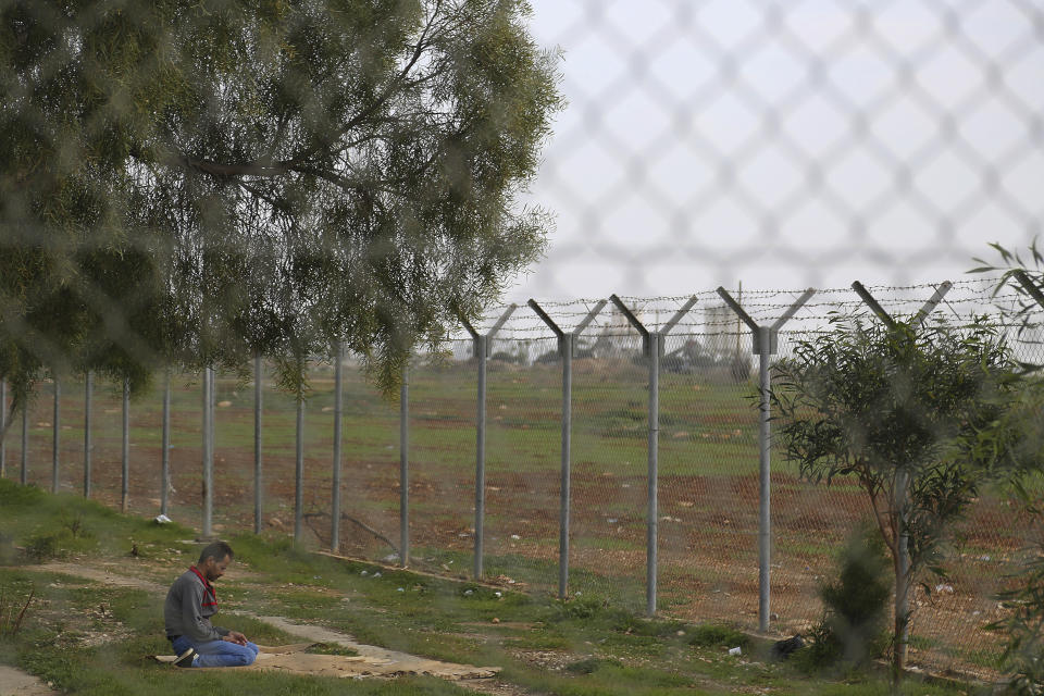 In this Tuesday, Nov. 27, 2018, a migrant from Syria at a refugee camp in Kokkinotrimithia outside of Nicosia, Cyprus. Cyprus was not seen as an attractive destination for migrants seeking shelter and a new life in Europe, but that has changed as other nations in Europe have shut their borders and the economic situation has slowly improved for the small island nation. (AP Photo/Petros Karadjias)