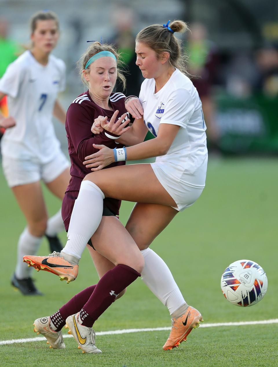 Walsh Jesuit's Reagan Pentz, left, collides with Olentangy Liberty's Karissa Friscone during the first half of the OHSAA Division I girls state soccer championship game Friday in Columbus.