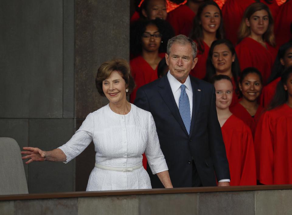 In this photo taken Sept. 24, 2016, former President George W. Bush and former first lady Laura Bush are seen in Washington. Falling in line with tradition, Bill and Hillary Clinton plan to attend Donald Trump's inauguration. It’s a decision that will put Hillary Clinton on the inaugural platform as her bitter rival from the 2016 campaign assumes the office she long sought. The Clintons announced their decision to attend the Jan. 20 inauguration shortly after former President George W. Bush's office said Tuesday he would attend along with former first lady Laura Bush. (AP Photo/Pablo Martinez Monsivais, File)