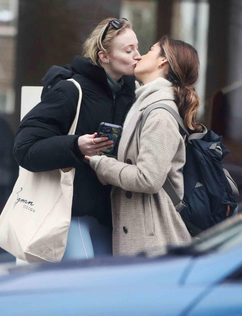 <p>Raw Image LTD/MEGA</p> Sophie Turner kissing her friend Tabitha Doherty goodbye