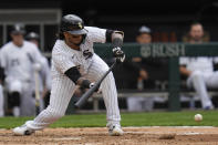 Chicago White Sox's Martín Maldonado hits a sacrifice bunt during the fifth inning of the first baseball game of a doubleheader against the Kansas City Royals Wednesday, April 17, 2024, in Chicago. (AP Photo/Erin Hooley)