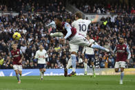 Tottenham's Harry Kane (10) heads past Aston Villa's Ezri Konsa in an attempt to score during the English Premier League soccer match between Tottenham Hotspur and Aston Villa at Tottenham Hotspur Stadium in London, Sunday, Jan. 1, 2023. (AP Photo/Ian Walton)