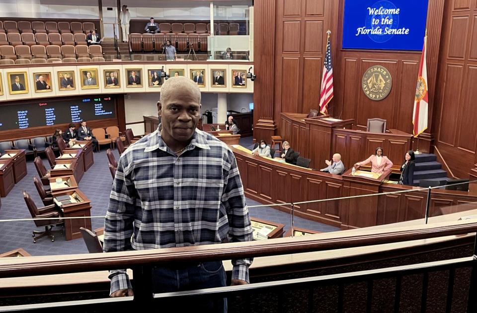 In this photo provided by the Innocence Project of Florida, Leonard Allan Cure poses from the floor of the Florida legislature in Tallahassee, Florida, in April 2023, on the day his compensation bill was passed. Cure, who spent more than 16 years in prison in Florida on a wrongful conviction, was shot and killed Monday, Oct. 16, 2023, by a sheriff's deputy in Georgia during a traffic stop, authorities and representatives said.