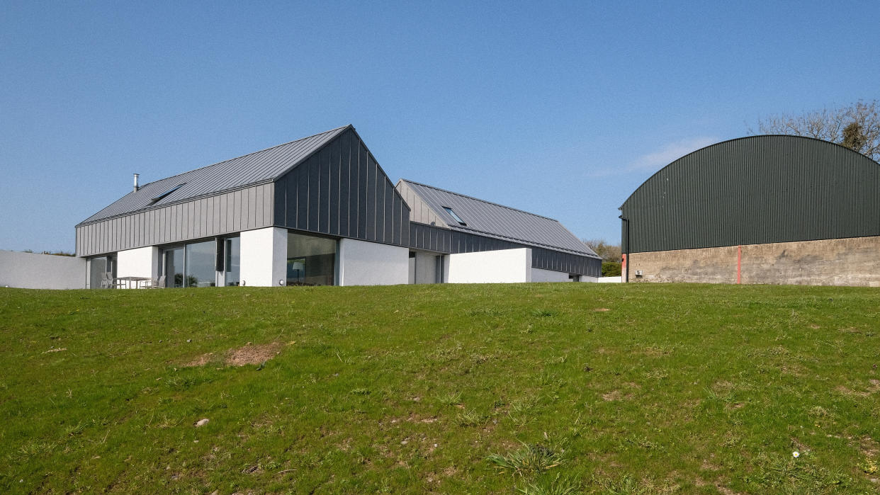 EMBARGOED TO 2200 WEDNESDAY NOVEMBER 13 Undated handout photo issued by Aidan McGrath of House Lessans, a three-bedroom property with white rendered, concrete walls in Co Down, Northern Ireland, which cost ??335,000 to build has been named House of the Year.