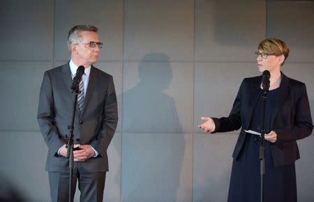 German Interior Minister Thomas de Maiziere (L) and Eva- Maria Kirschsieper, Facebook head of public policy D-A-CH, speak to the media after a vistit at the Facebook office in Berlin, Germany August 29, 2016. REUTERS/Stefanie Loos