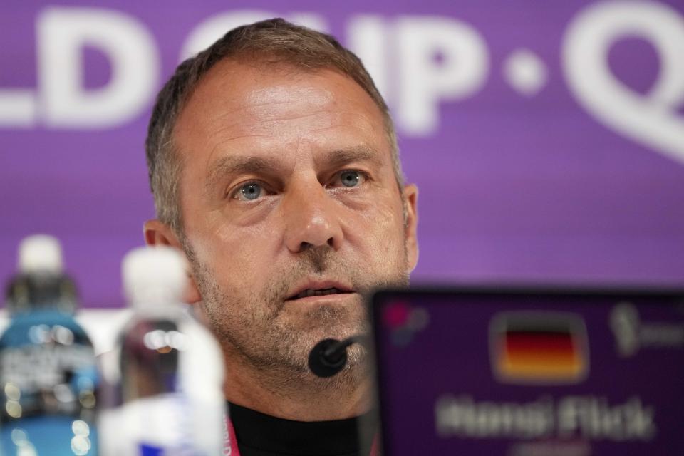 Germany's head coach Hansi Flick attends a news conference on the eve of the group E World Cup soccer match between Germany and Japan, in Doha, Qatar, Tuesday, Nov. 22, 2022. Germany will play the first match against Japan on Wednesday, Nov. 23. (AP Photo/Matthias Schrader)