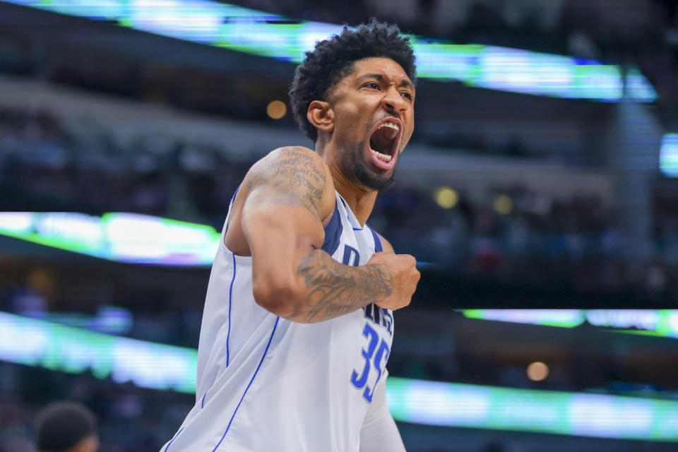 Dallas Mavericks center Christian Wood celebrates after dunking during the second half of the team's NBA basketball game against the Utah Jazz, Wednesday, Nov. 2, 2022, in Dallas. (AP Photo/Gareth Patterson)