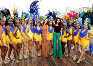 <p>The supermodel duo posed for a photo with samba dancers whilst filming for The Today Show. <i>[Photo: Getty Images]</i></p>
