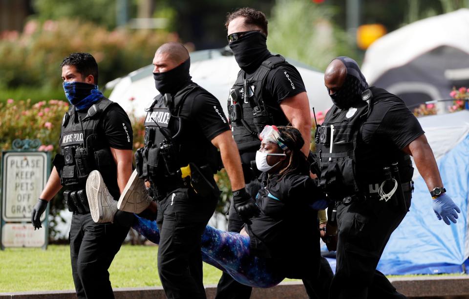 Salmander Pride is carried away by Memphis Police officers after refusing to leave Civic Center Plaza on Wednesday, July 1, 2020.  City officials announced plans Tuesday to remove protesters camped out for the past two weeks.