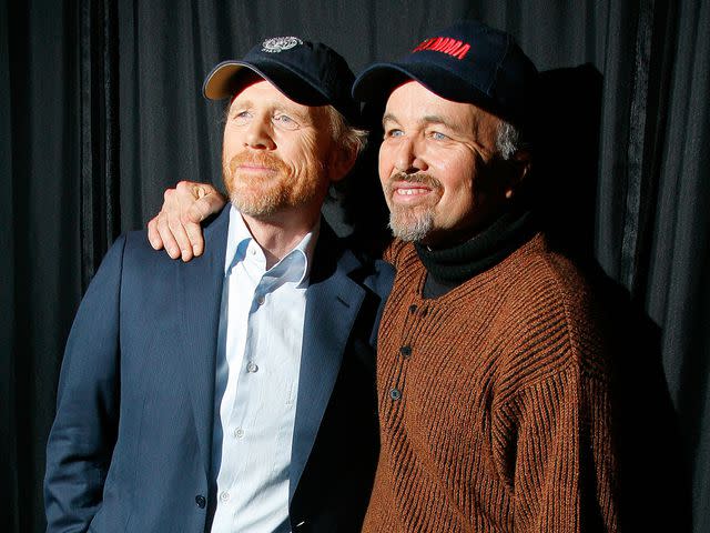 <p>Andy Kropa/Getty</p> Ron Howard (left) and Clint Howard