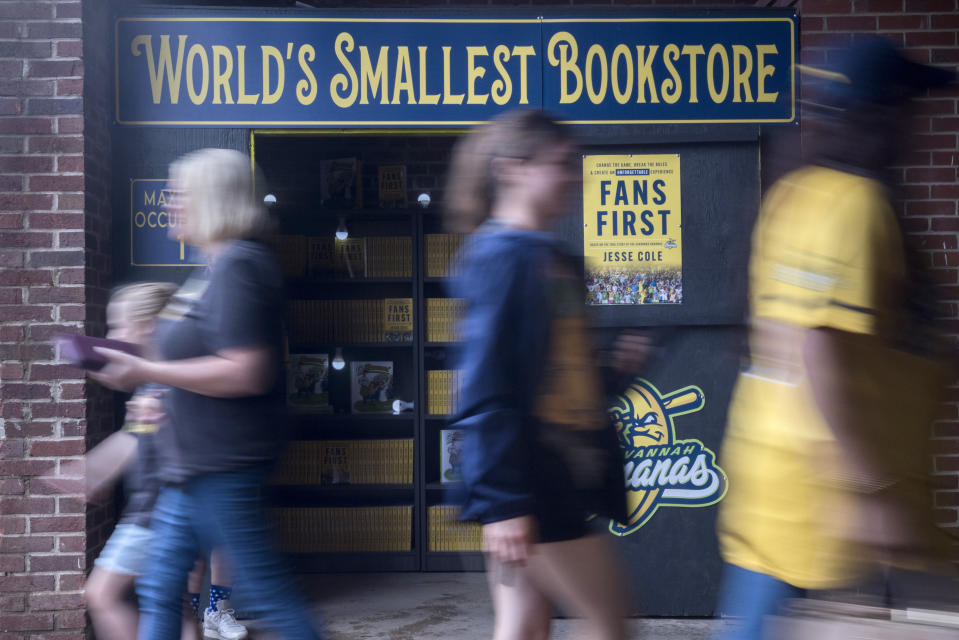 Savannah Bananas owner Jesse Cole uses a small room in the stadium to sell his book, Thursday, June 9, 2022, in Savannah, Ga. (AP Photo/Stephen B. Morton)