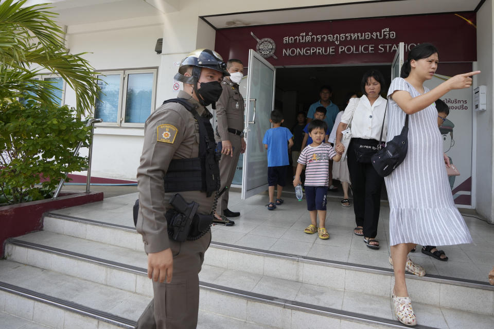 Members of the Shenzhen Holy Reformed Church, also known as the Mayflower Church, leave from the Nongprue police station on their way to Pattaya Provincial Court in Pattaya, Thailand, Friday, March 31, 2023. More than 60 members of a Chinese Christian church have been detained in Thailand, supporters said Friday, raising fears they may be returned to their home country, where they face possible persecution. (AP Photo/Sakchai Lalit)