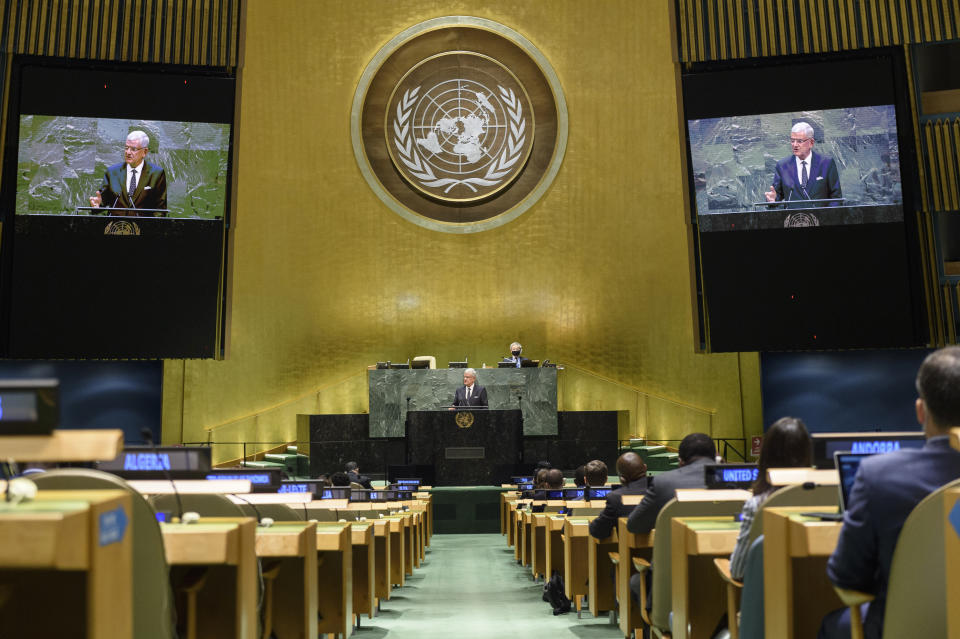 In this UN Photo, Volkan Bozkir, President of the 75th session of the United Nations General Assembly, is shown on video monitors as he makes closing remarks, Tuesday, Sept. 29, 2020, at U.N. headquarters. (Loey Felipe/UN Photo via AP)