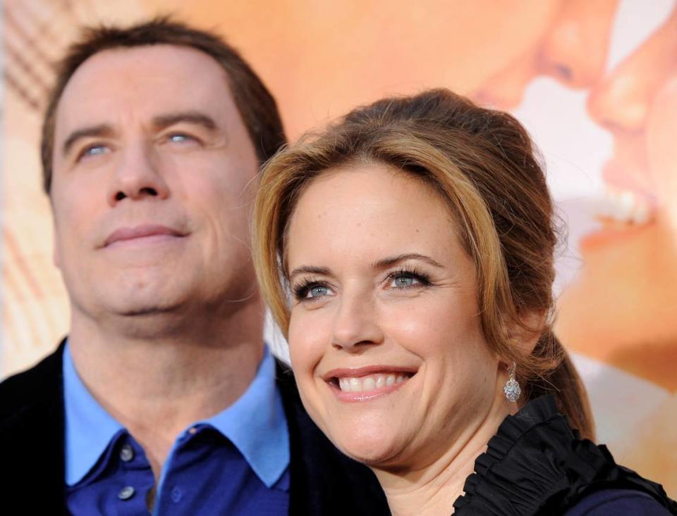 FILE -- A March 25, 2010, file photo shows Kelly Preston, right, a cast member in “The Last Song,” with her husband John Travolta at the premiere of the film in Los Angeles. Actress Kelly Preston, whose credits included the films “Twins” and “Jerry Maguire,” died Sunday, July 12, 2020, her husband John Travolta said. She was 57.(AP Photo/Chris Pizzello, File)
