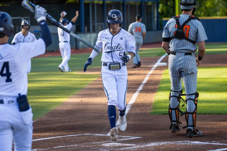 Georgia Southern second baseman Jesse Sherrill scores a run against Mercer on May 17, 2022 on Jack Stallings Field at J.I. Clements Stadium in Statesboro. Sherrill was 4-for-5 and scored three runs in a 21-7 victory over the Bears. Sherrill was All-Sun Belt first team this season, leading the Eagles in batting average (.368, 84th in Division I), hits (75) and stolen bases (13 in 15 attempts).