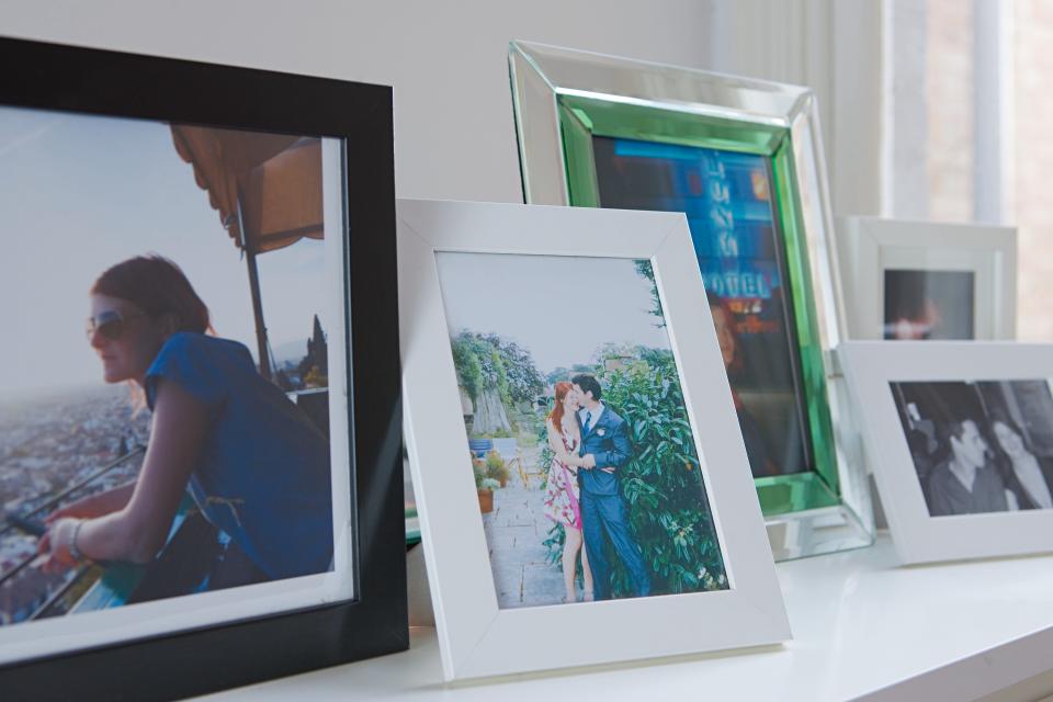 Bringing mementos like photo frames, art, and beloved books can help you feel at home in a new environment.