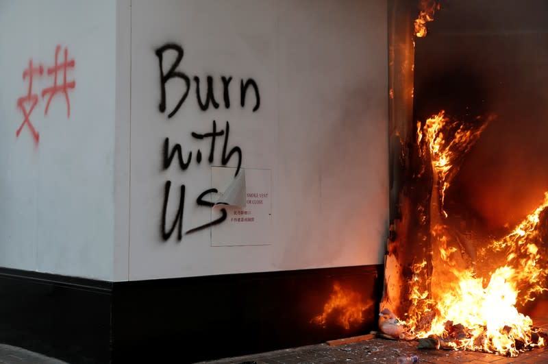 Graffiti is seen on the wall of a Bank of China branch during a demonstration in Central, Hong Kong