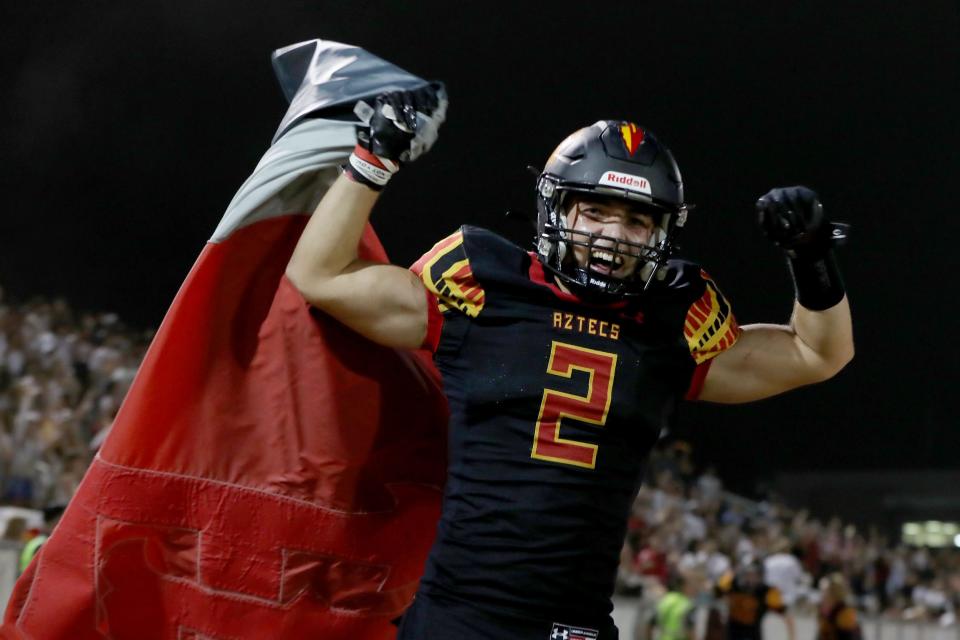 Dawson Johnson (2) of Palm Desert High celebrates the victory in the Flag Game against La Quinta High in Palm Desert, Calif., on Friday, Sept. 29, 2023.