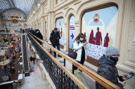 People stand in a queue to get a shot of Russia's Sputnik V coronavirus vaccine in a vaccination center in GUM State Department store in Moscow, Russia, Wednesday, Jan. 20, 2021. Russia started a mass coronavirus vaccination campaign on Monday, Jan. 18. (AP Photo/Pavel Golovkin)