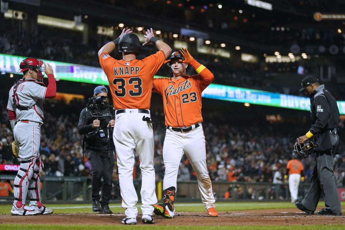 San Francisco Giants' Brandon Belt, left, celebrates with Evan