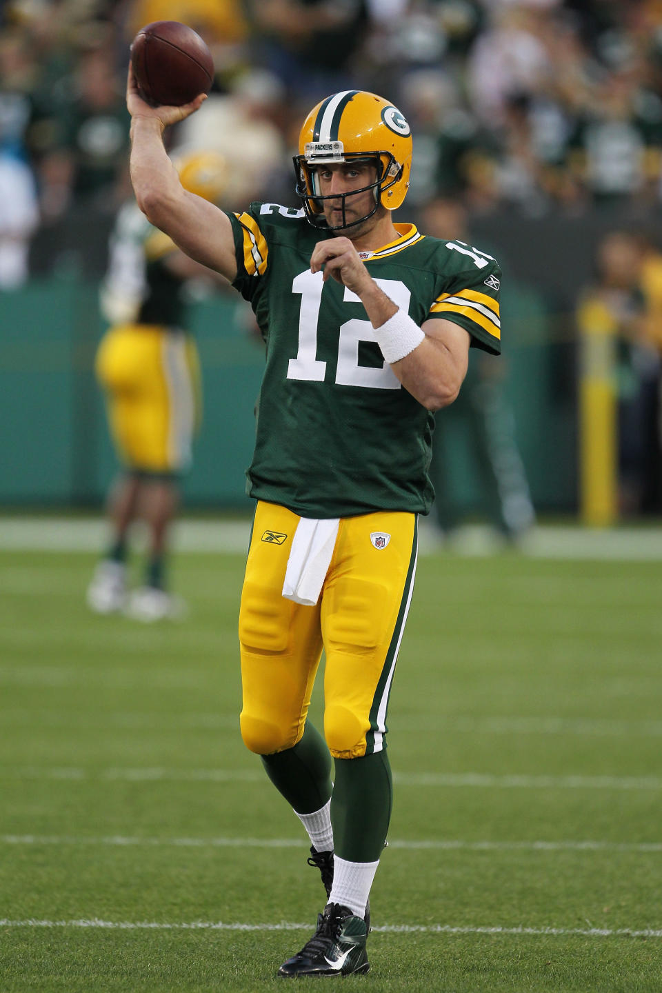 GREEN BAY, WI - SEPTEMBER 08: Aaron Rodgers #12 of the Green Bay Packers warms up before taking on the New Orleans Saints in the season opening game at Lambeau Field on September 8, 2011 in Green Bay, Wisconsin. (Photo by Jonathan Daniel/Getty Images)
