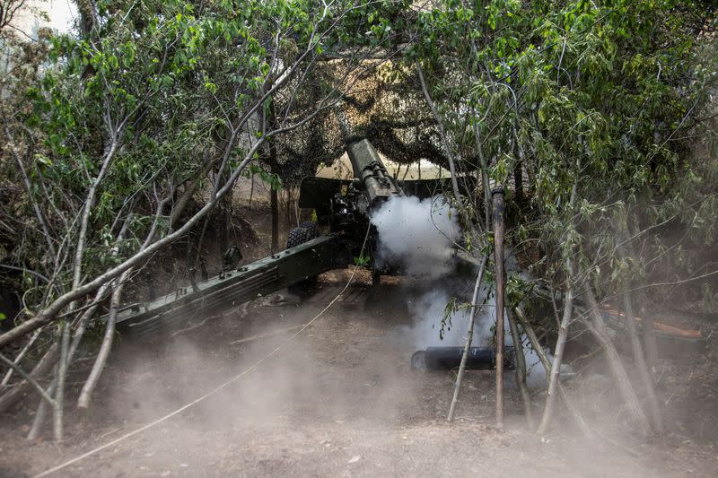 Ukrainian servicemen fire a 2A36 Giatsint-B howitzer towards Russian troops near a front line in Donetsk region