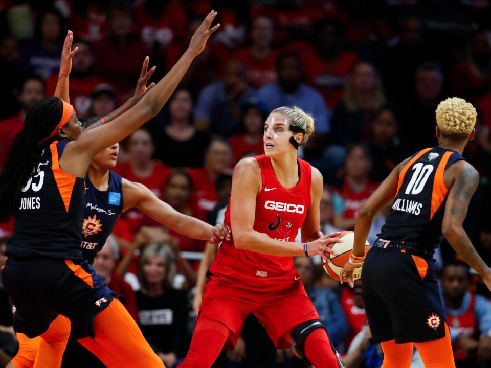 FILE - In this Oct. 10, 2019, file photo, Connecticut Sun forward Jonquel Jones, left, and guard Courtney Williams, right, huard Washington Mystics forward Elena Delle Donne during the first half of Game 5 of basketball's WNBA Finals in Washington. Delle Donne is waiting to have her case heard by the league's independent panel of doctors to see if she'll be medically excused for the season, according to the Mystics.
The Mystics star, who was the league Most Valuable Player last year, has battled Lyme Disease since 2008 and would potentially be at a higher risk for serious illness if she contracted the new coronavirus. (AP Photo/Alex Brandon, File)