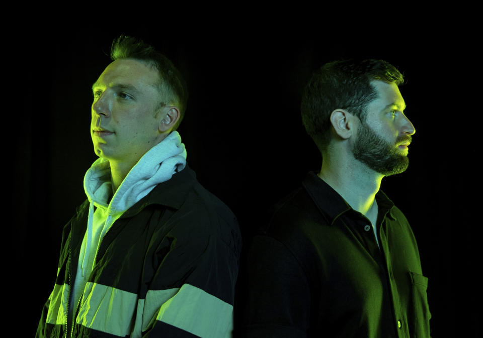 Clayton Knight, left, and Harrison Mills of ODESZA pose for a portrait at Angel of the Winds Arena on Monday, July 18, 2022, in Everett, Wash. (AP Photo/Lindsey Wasson)