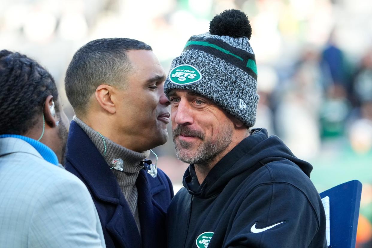 Nov 24, 2023; East Rutherford, New Jersey, USA; New York Jets quarterback Aaron Rodgers (8), on injured reserve, with broadcaster Tony Gonzalez, pregame against the Miami Dolphins at MetLife Stadium. Mandatory Credit: Robert Deutsch-USA TODAY Sports