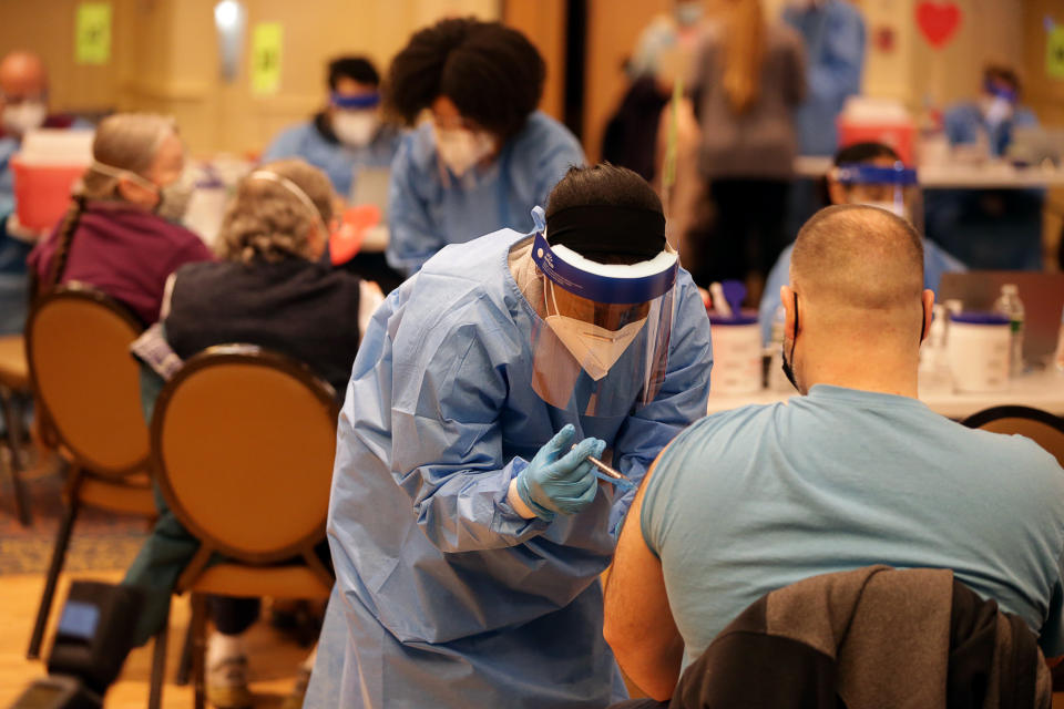 People receiving a COVID-19 vaccine