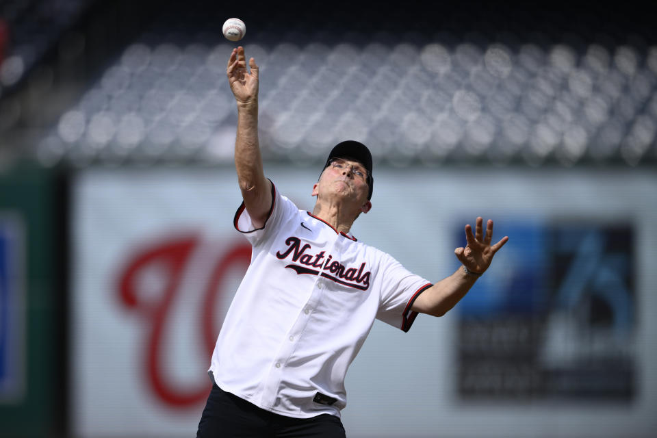 Secretary General to NATO Jens Stoltenberg throws out a ceremonial first pitch before a baseball game between the Washington Nationals and the St. Louis Cardinals, Monday, July 8, 2024, in Washington. (AP Photo/Nick Wass)