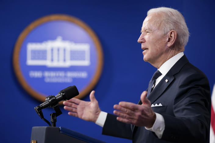 President Joe Biden speaks in the South Court Auditorium in the Eisenhower Executive Office Building on the White House Campus in Washington, Friday, Jan. 21, 2022. (AP Photo/Andrew Harnik)