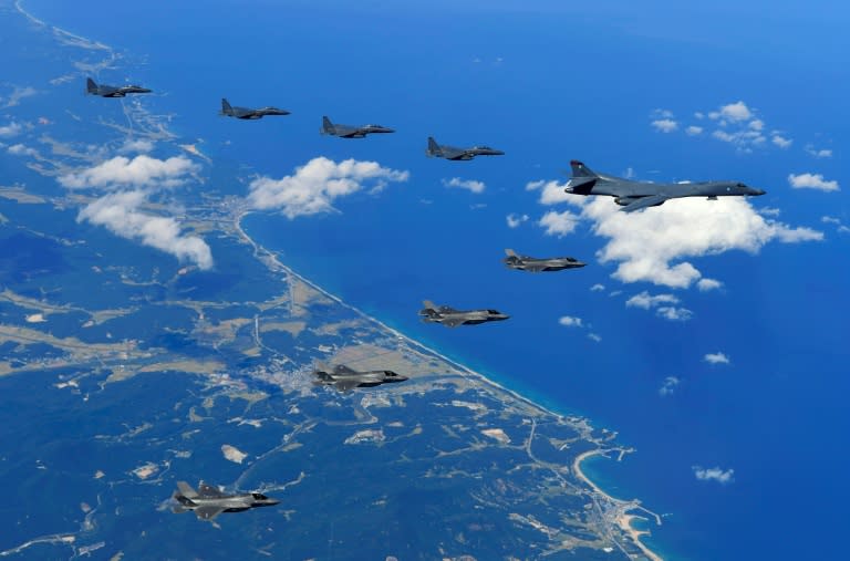 A US Air Force B-1B Lancer bomber, US F-35B stealth jet fighters and South Korean F-15K fighter jets fly over South Korea during a joint military drill