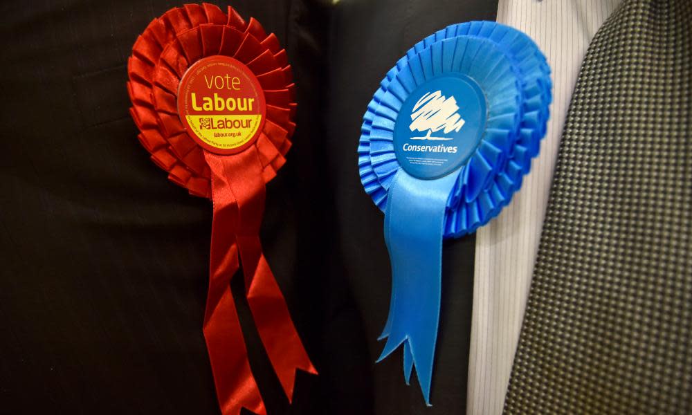 Labour and Conservative party rosettes